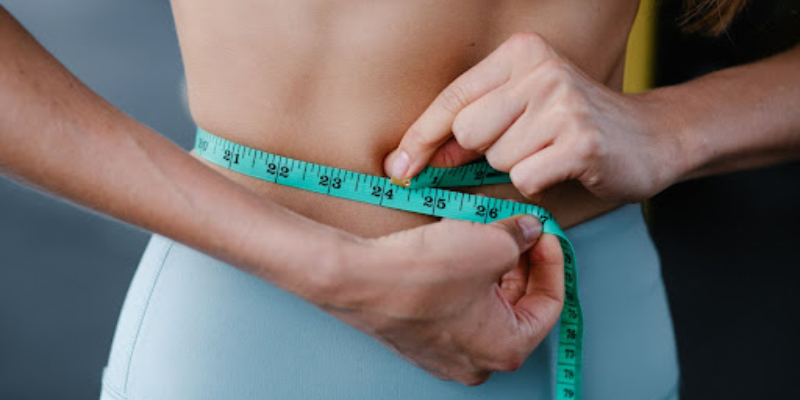 measuring tape around a women's waist